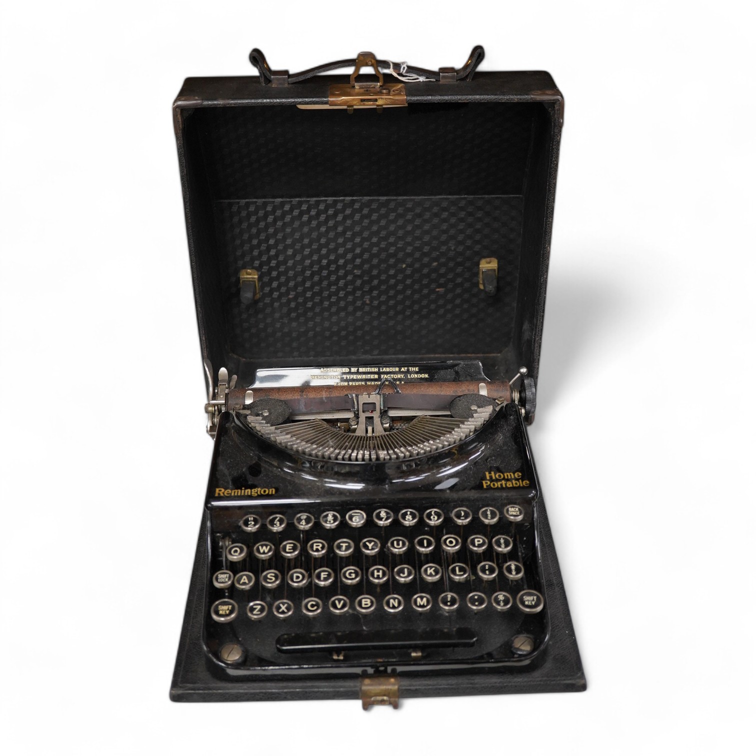 A cased Remington Home Portable typewriter. Condition - fair.